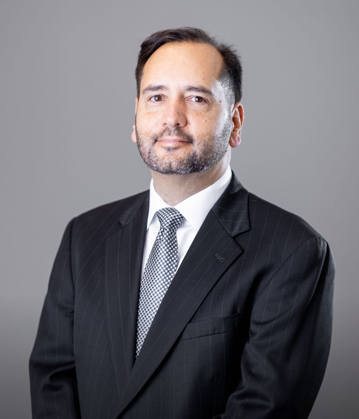 Professional portrait of a man in a suit.